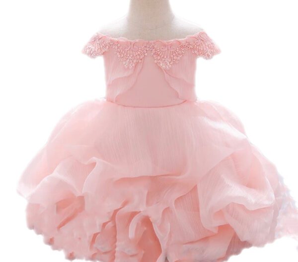 A pink dress is shown with ruffles.