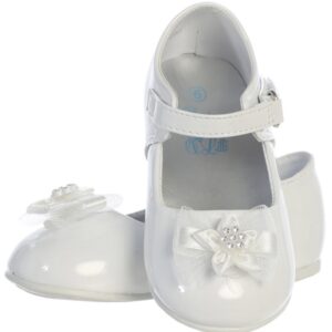 A pair of white shoes with bows on the front.