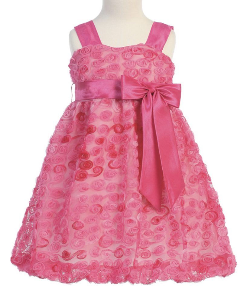 A sleeveless strap pink frock with a huge bow