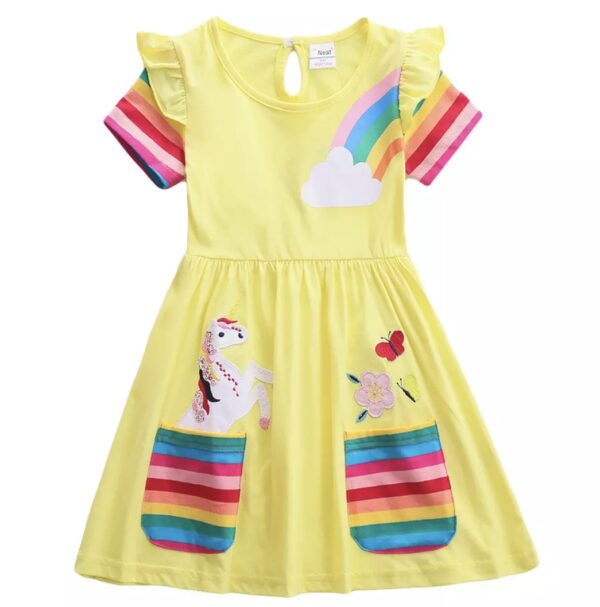 A yellow dress with rainbow and unicorn patches.