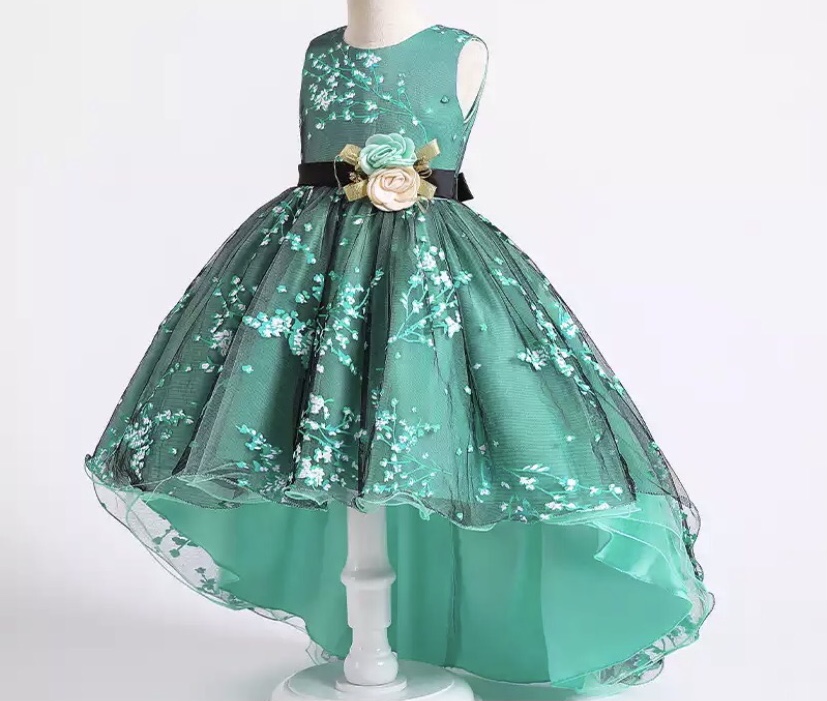 A teal colored floral frock with a flower bow