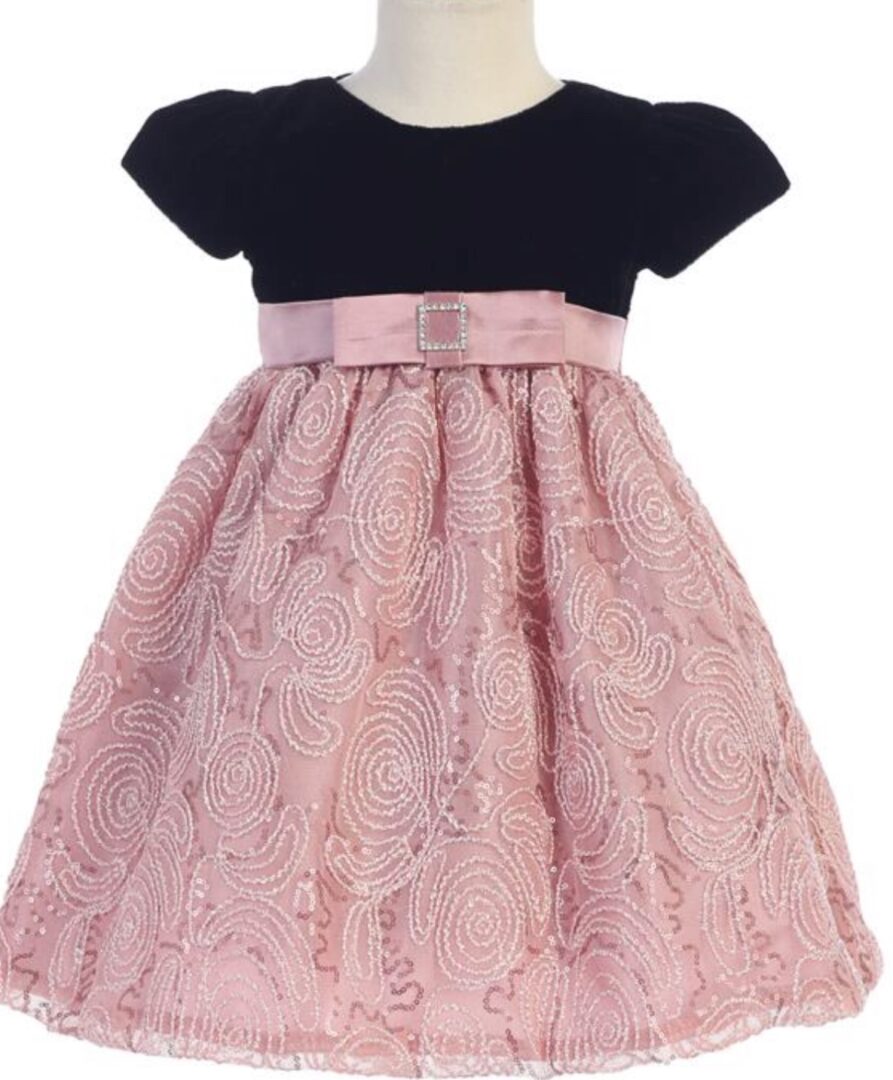 A pink dress with black top and lace skirt.