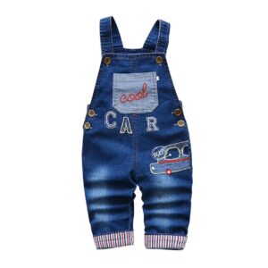 A baby wearing overalls with the word car on it.
