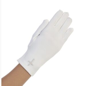A person wearing white gloves with a cross on it.