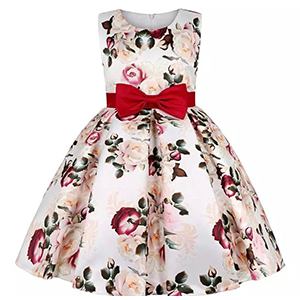A white dress with red bow and flowers