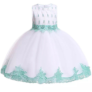 A white and green dress with lace trim